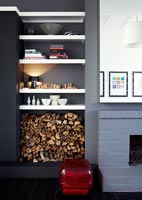 Modern shelving by fireplace