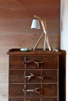 Wooden chest of drawers with antler handles