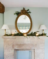 Cotswold stone mantlepiece with antique gilt mirror