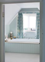 Country bathroom with linen curtains