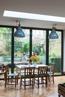 Modern dining room with view of garden