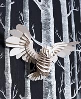Modern wall paper and owl ornament