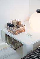 Modern side table and vintage boxes