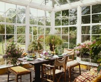 Classic conservatory with table set for meal