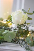 Arrangement of Eucalyptus and Pine foliage and Roses