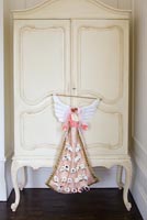 Cream armoire with Christmas advent angel