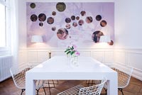 Contemporary white dining room with epoxy painted table