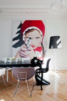 Contemporary dining room with 'Little Red Riding Hood Aiming Revolver' photo by Sandra Seckinger