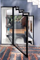 Contemporary glazed door under stairs
