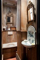 Bathroom with reclaimed wooden panelling