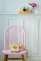 Pastel pink chair and telephone