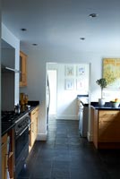 Modern kitchen with slate flooring