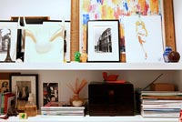 Accessories and artwork on white shelves