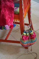 Upcycled chair with colourful accessories