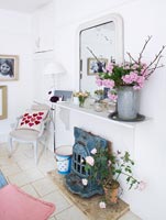 Floral display of Hydrangeas and Roses around fireplace