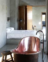 Contemporary bedroom with bath