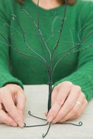 Using cotton wool and garden wire to create a Christmas tree - Flattening tree legs for stability