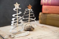 Christmas decorations made from newspaper and driftwood