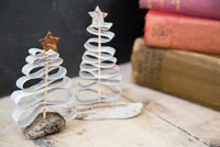 Christmas decorations made from newspaper and driftwood