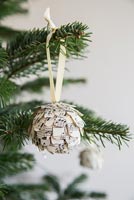 Step by Step guide for making paper cones using music sheet paper - finished bauble on tree
