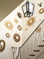 Decorative mirrors displayed on stairwell