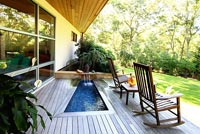 Contemporary raised patio with water feature