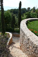 Stone steps through modern garden