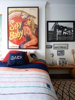 Vintage poster above bed