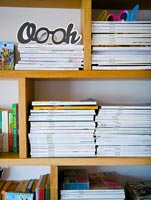 Magazines on wooden shelves