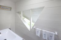 Triangular window in bathroom