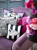 Patterned cushions on purple chair
