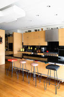 Modern kitchen with retro barstools