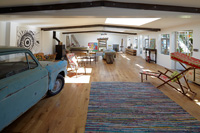 Open plan room with vintage car