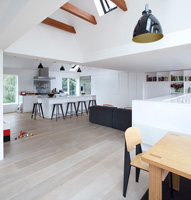 Contemporary open plan kitchen with untreated limed oak flooring