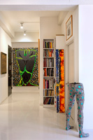 White hallway with colourful art