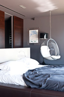 Contemporary bedroom with bubble chair