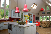 Colourful kitchen extension with seating area