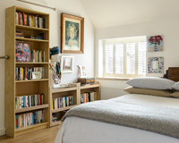 Wooden bookcase in bedroom