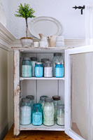 Storage jars in vintage cabinet