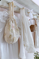 Vintage clothing hanging from pegs
