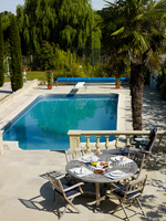 Mediterranean style garden with swimming pool