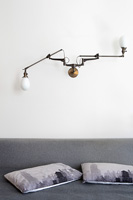 Industrial style lighting above bed