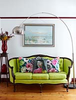 Colourful cushions on classic sofa