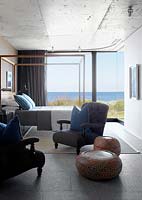 Contemporary bedroom overlooking sea