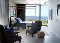 Contemporary bedroom overlooking sea