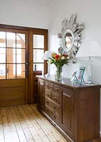 Wooden chest of drawers in hall