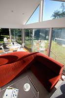 Red sofa in open plan extension