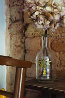 Dried Hydrangea flower in vintage bottle