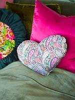 Colourful cushions on sofa