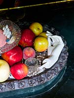Fruit and accessories in metal bowl